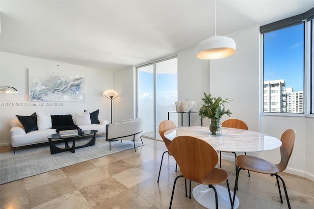 dining room featuring a wall of windows