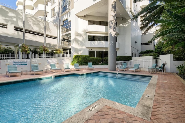 view of pool featuring a patio