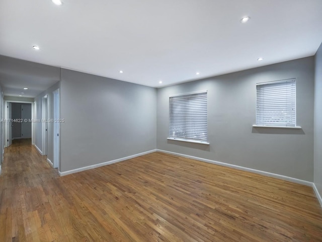 1018 Meridian Ave Unit 4, Miami Beach, FL 33139 - spare room featuring baseboards, wood finished floors, and recessed lighting