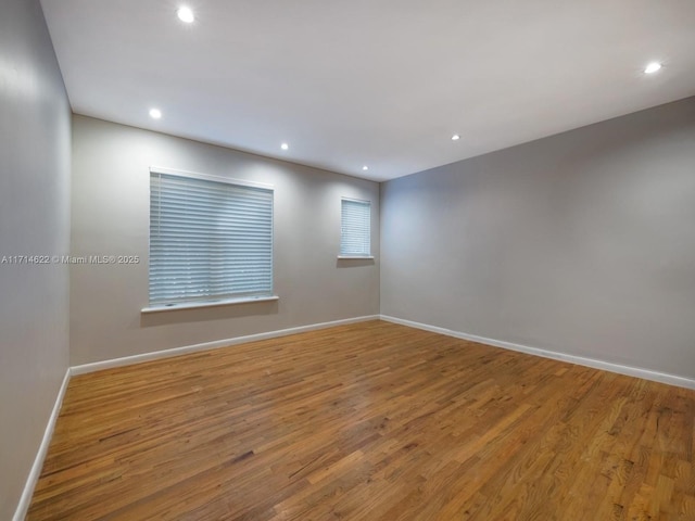 1018 Meridian Ave Unit 4, Miami Beach, FL 33139 - unfurnished room featuring baseboards, wood finished floors, and recessed lighting