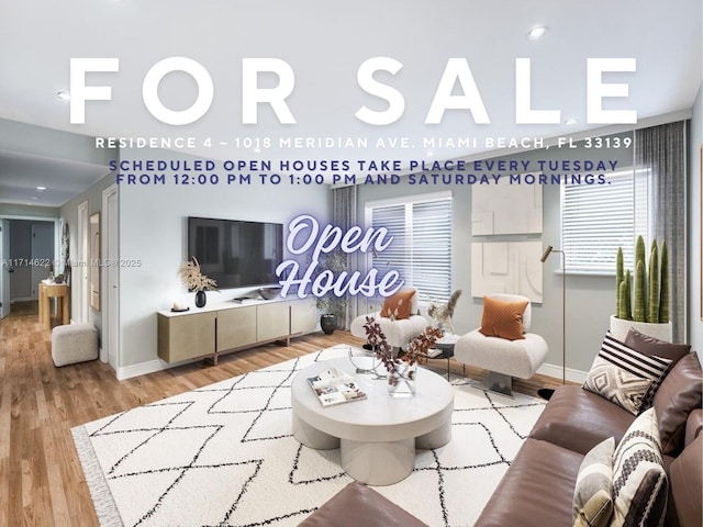 1018 Meridian Ave Unit 4, Miami Beach, FL 33139 - living room featuring baseboards and wood finished floors