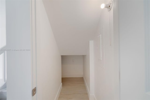 interior space with hardwood / wood-style floors and vaulted ceiling