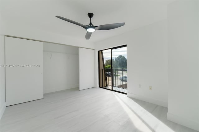 unfurnished bedroom with ceiling fan, access to outside, and a closet