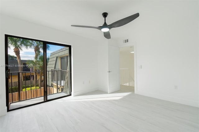 unfurnished room featuring light wood-type flooring, ceiling fan, and a healthy amount of sunlight