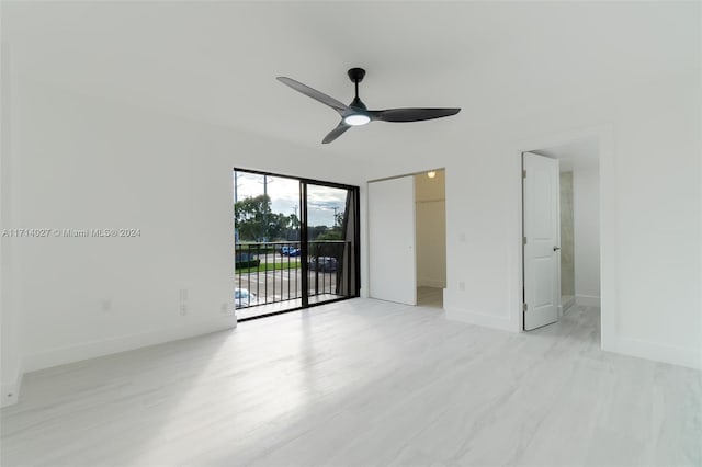 unfurnished bedroom with access to exterior and ceiling fan