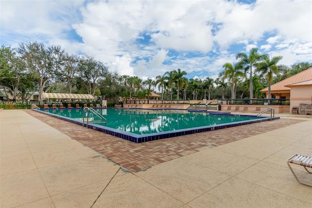 view of swimming pool featuring a patio