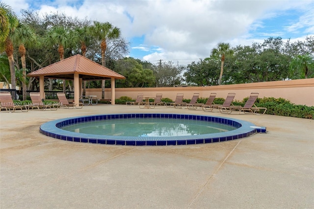 view of swimming pool featuring a gazebo and a patio area