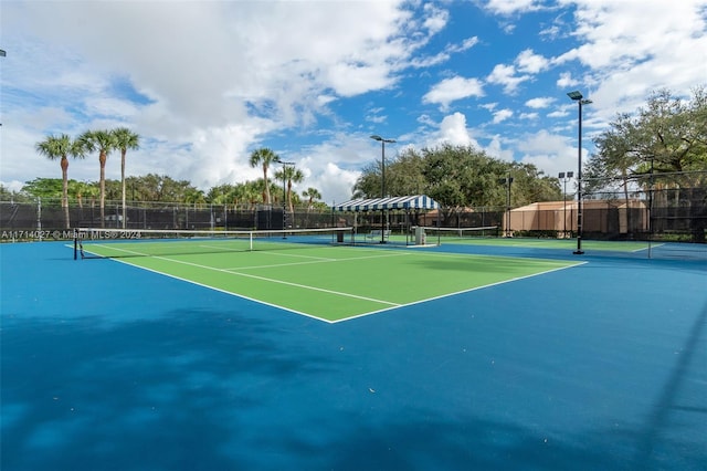 view of sport court with basketball hoop