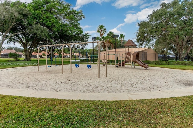 view of playground with a lawn