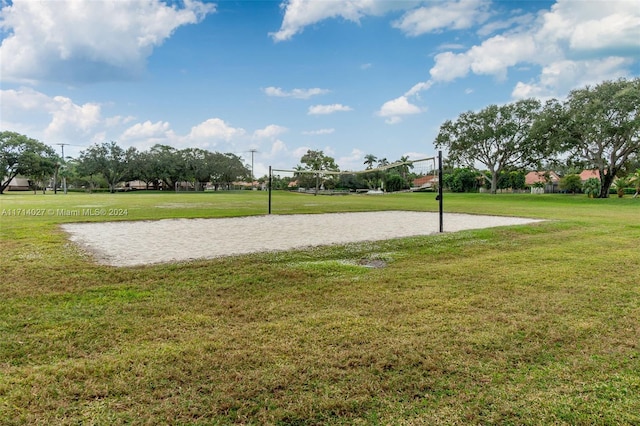 view of community featuring a yard and volleyball court