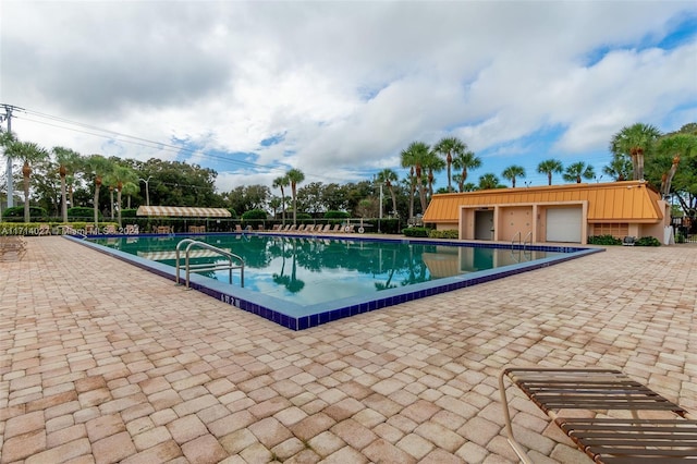 view of swimming pool with a patio area