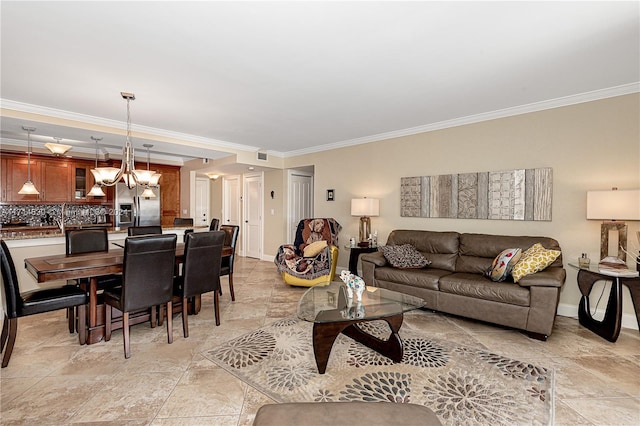 living room featuring a notable chandelier and crown molding