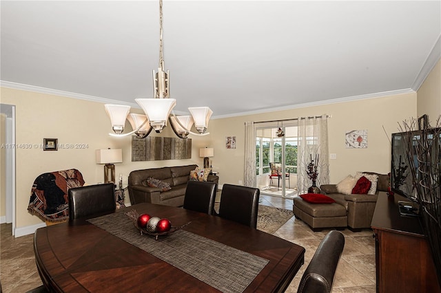 dining area featuring crown molding and a chandelier