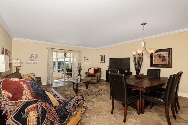 dining room with crown molding and an inviting chandelier