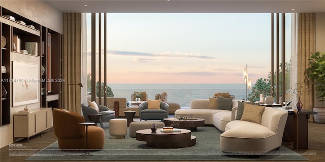 sitting room featuring expansive windows, a water view, a wealth of natural light, and dark hardwood / wood-style floors