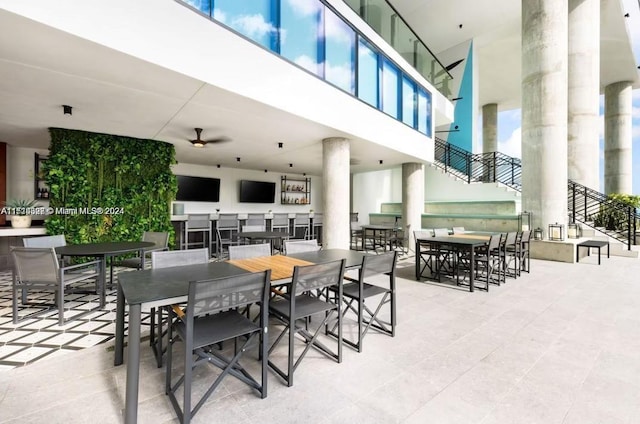 dining space featuring tile patterned floors and ceiling fan