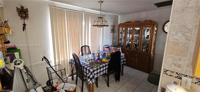 dining room featuring light tile patterned flooring