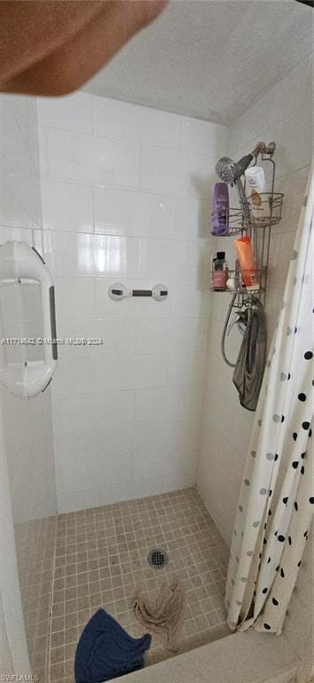 bathroom featuring a shower with curtain and tile patterned floors