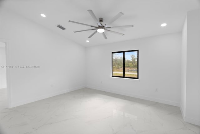 spare room featuring light marble finish flooring, recessed lighting, baseboards, and a ceiling fan