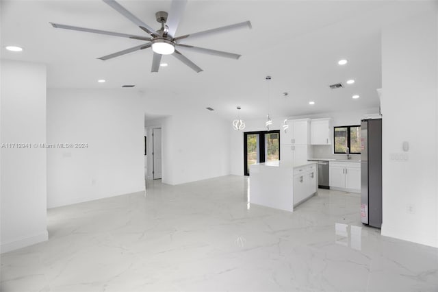 unfurnished living room featuring a ceiling fan, recessed lighting, light marble finish flooring, and vaulted ceiling