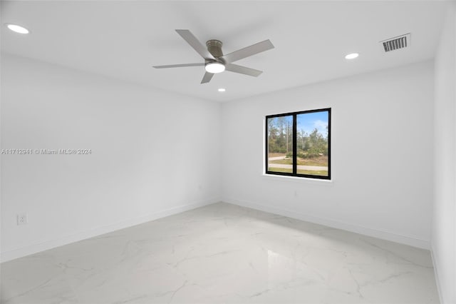empty room with recessed lighting, light marble finish floors, baseboards, and a ceiling fan