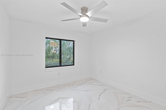 spare room with ceiling fan