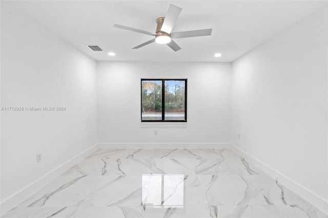 unfurnished room with ceiling fan