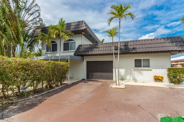 view of front of home with a garage