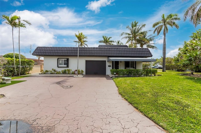 ranch-style house with a front yard, solar panels, and a garage