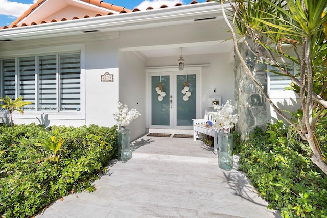 entrance to property featuring french doors