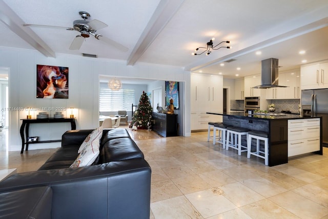 living room featuring crown molding, beam ceiling, and ceiling fan