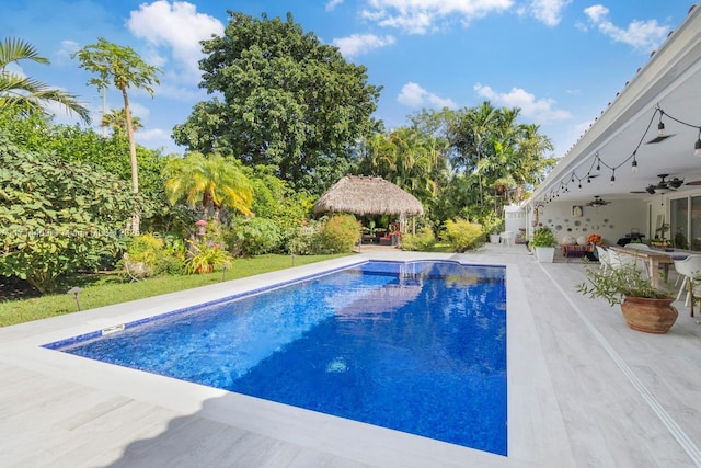 view of pool with a gazebo, ceiling fan, and a patio