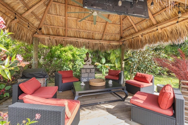 view of patio featuring a grill, a gazebo, outdoor lounge area, and ceiling fan