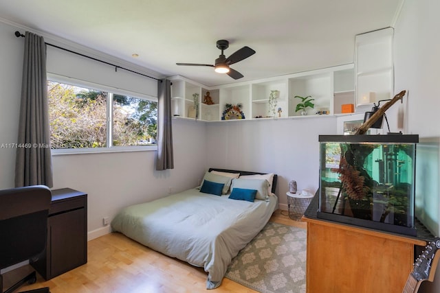 bedroom with ceiling fan and light hardwood / wood-style flooring