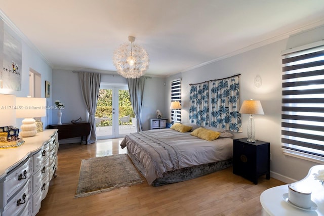 bedroom featuring ornamental molding, light hardwood / wood-style flooring, access to exterior, and french doors