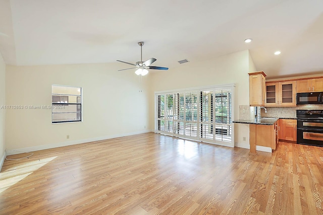 kitchen featuring black appliances, ceiling fan, light hardwood / wood-style floors, and tasteful backsplash