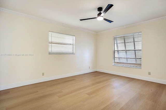 spare room featuring ceiling fan, light hardwood / wood-style flooring, and crown molding