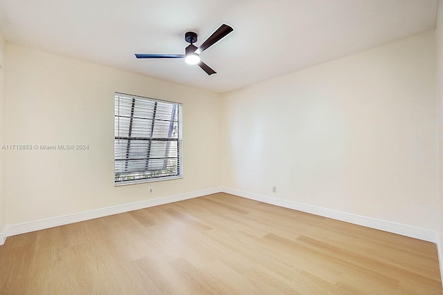 empty room featuring ceiling fan and light hardwood / wood-style flooring