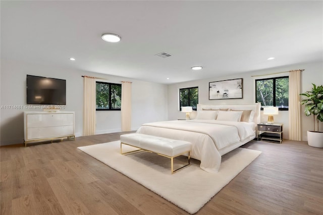 bedroom with light hardwood / wood-style floors