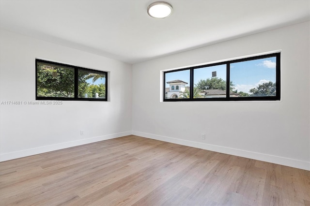 unfurnished room featuring light wood-type flooring