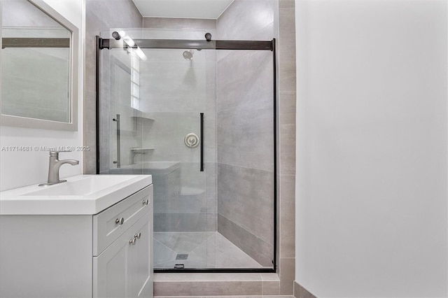 bathroom featuring vanity and walk in shower