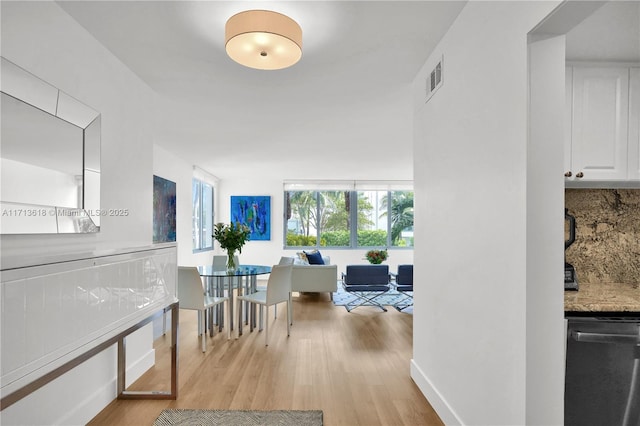 corridor featuring light hardwood / wood-style floors