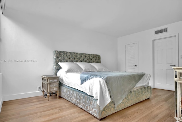 bedroom featuring light hardwood / wood-style floors