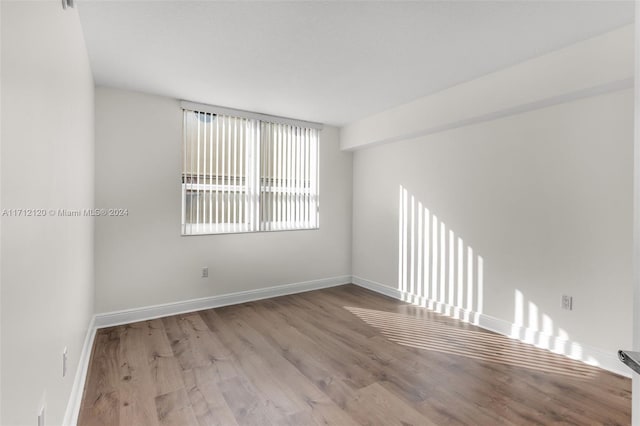 unfurnished room featuring light hardwood / wood-style floors