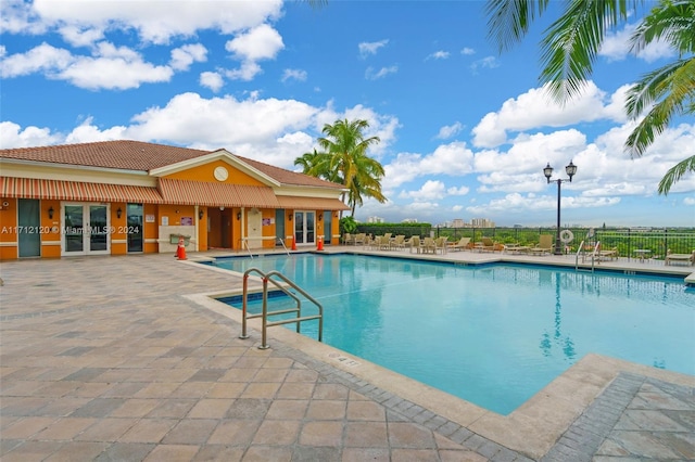 view of pool featuring a patio area