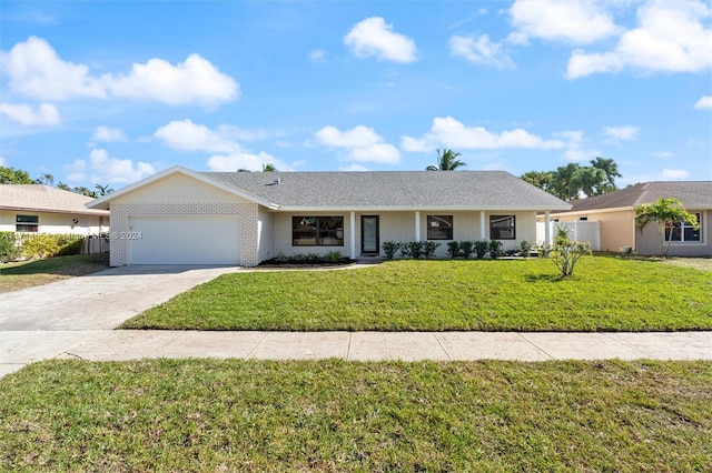 single story home featuring a garage and a front yard