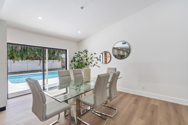 dining space with light wood-type flooring