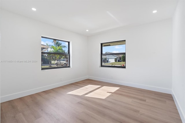 spare room with light wood-type flooring