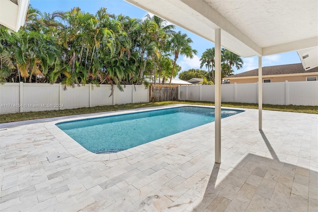 view of swimming pool featuring a patio