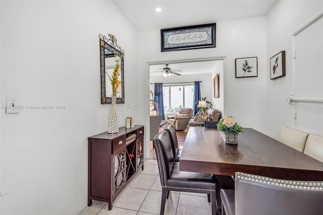 dining space with ceiling fan and light tile patterned flooring